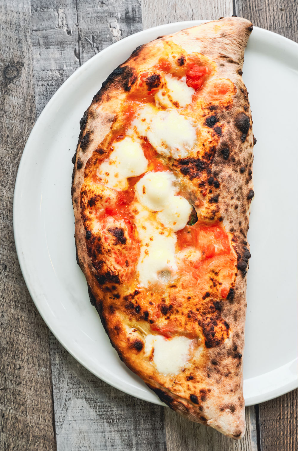 a fresh-made calzone straight from the wood-fired oven at da laposta